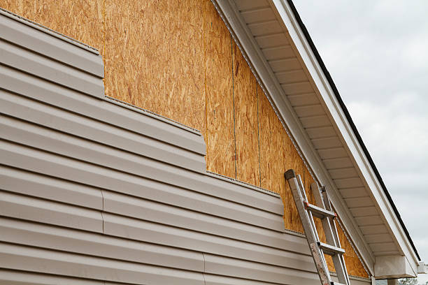 Professional Emergency Siding Repair technician working in Elkton, FL